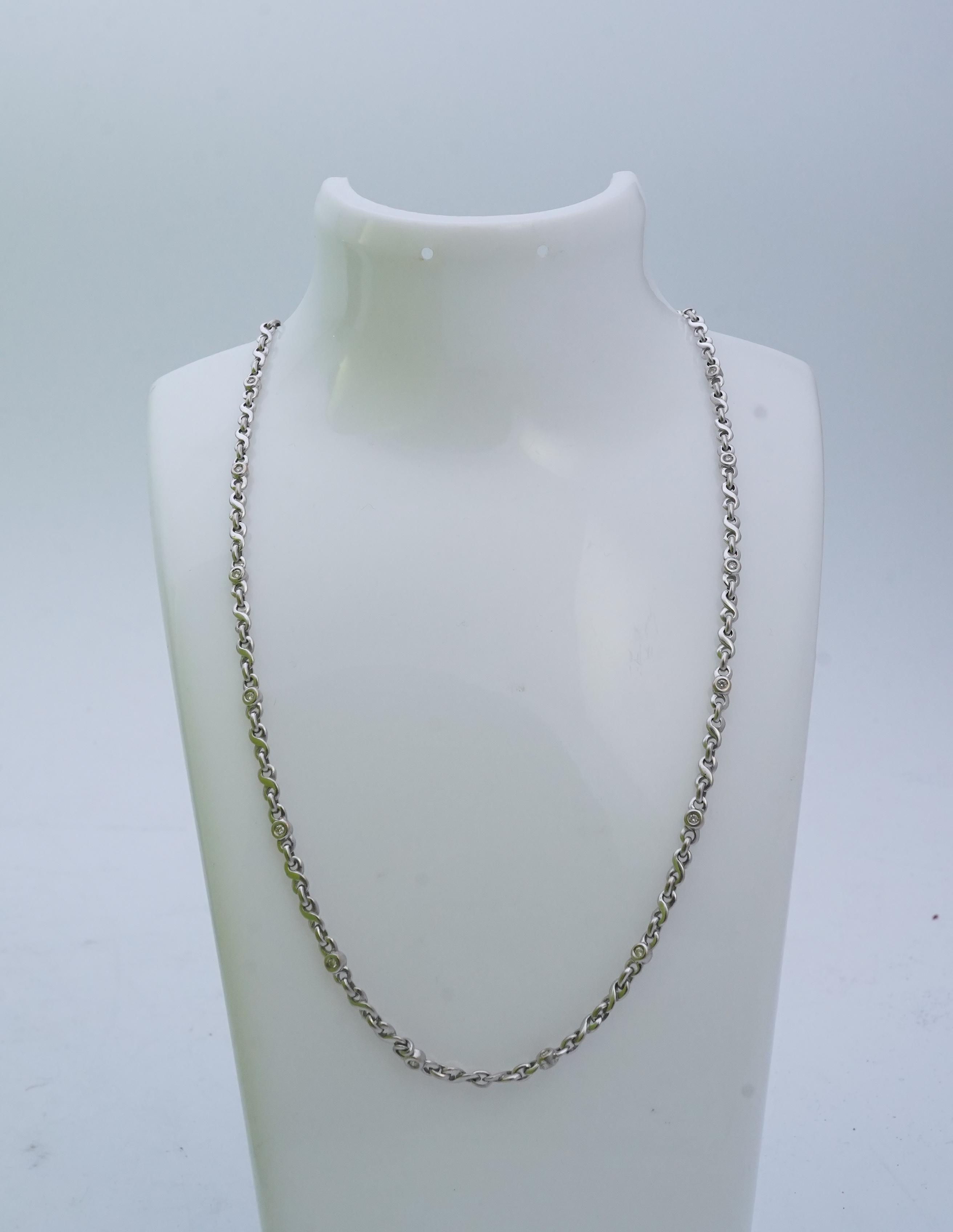 A white gold and diamond necklace